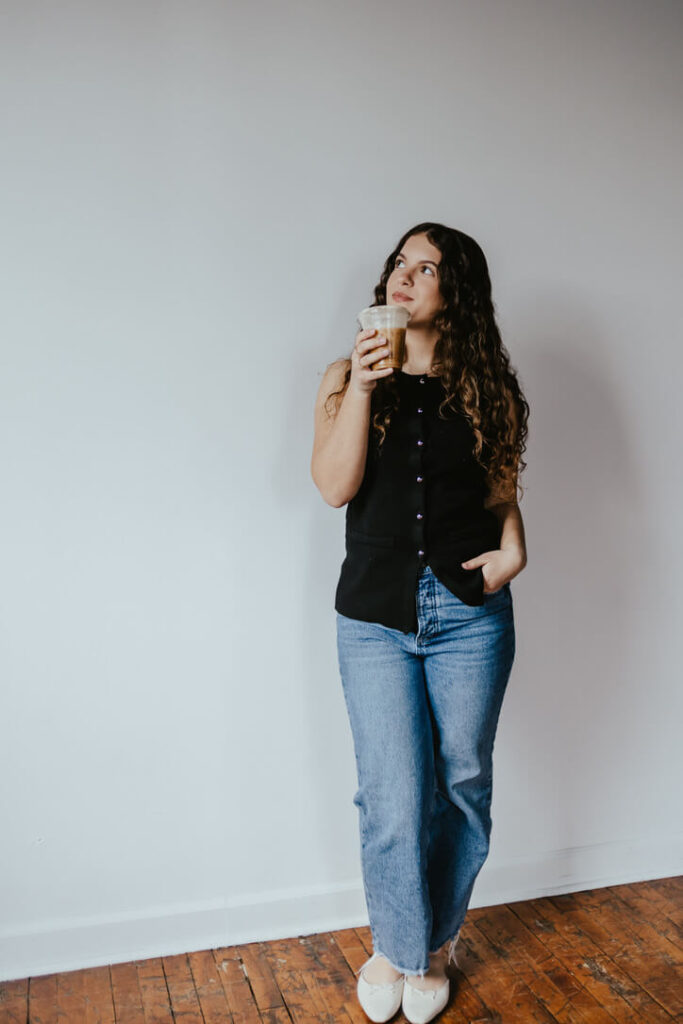 Woman holding coffee in a coffee shop in Mechanicsburg, PA