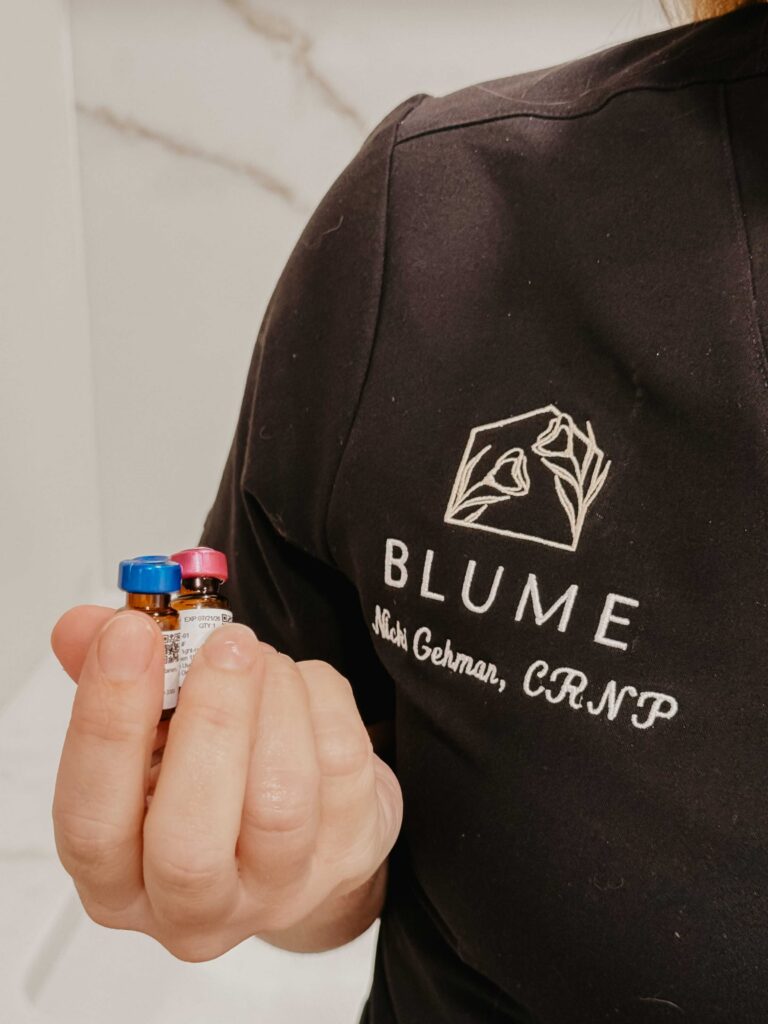 Blume Med Spa employee with injectable vials ready for customers