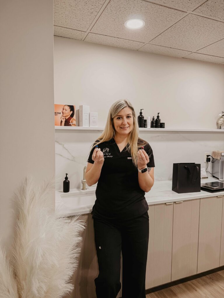 Blume Med Spa employee holding injectable vials