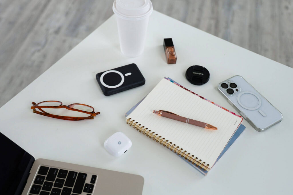 Content creator tools including an iPhone, computer, and charger